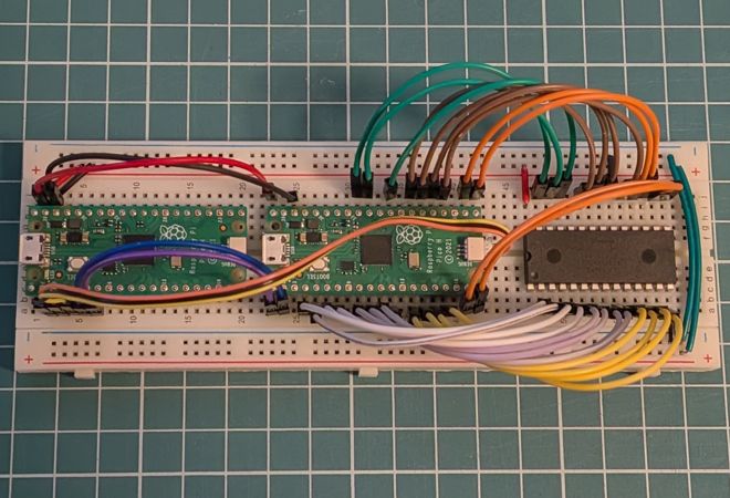 Two Raspberry Pi Picos and the EEPROM they are programming